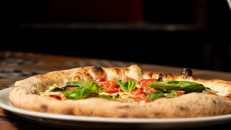 Round table pizza classic margherita pizza with fresh basil